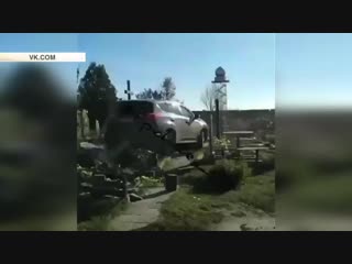 a priest in a jeep drove over the graves at the cemetery in kharkov